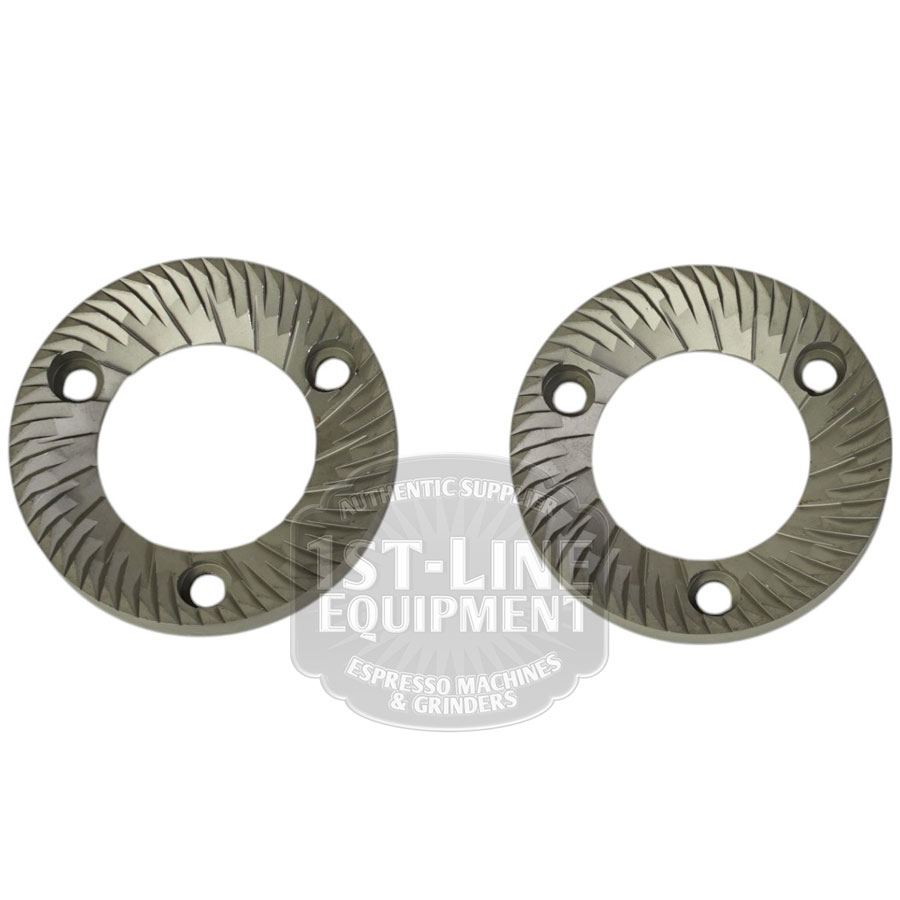 A set of two Mazzer FMA00182D/QQQ 1-phase 58mm flat grinding burrs, each with angled cutting teeth and three screw holes, displayed side by side on a white background. © 2025 1st-line.com