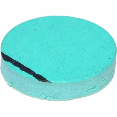 A round, flat, turquoise mineral with a rough texture and a visible black vein diagonally across its surface, resembling the unique pattern of the Bezzera 5492011 Gasket D15X3 for Mitica. © 2025 1st-line.com