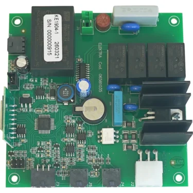 A green Elektra 06581035 Verve Electronic Card Brain Unit is shown from above, featuring relays, capacitors, connectors, a coin cell battery, and a large black module labeled with a serial number. © 2025 1st-line.com