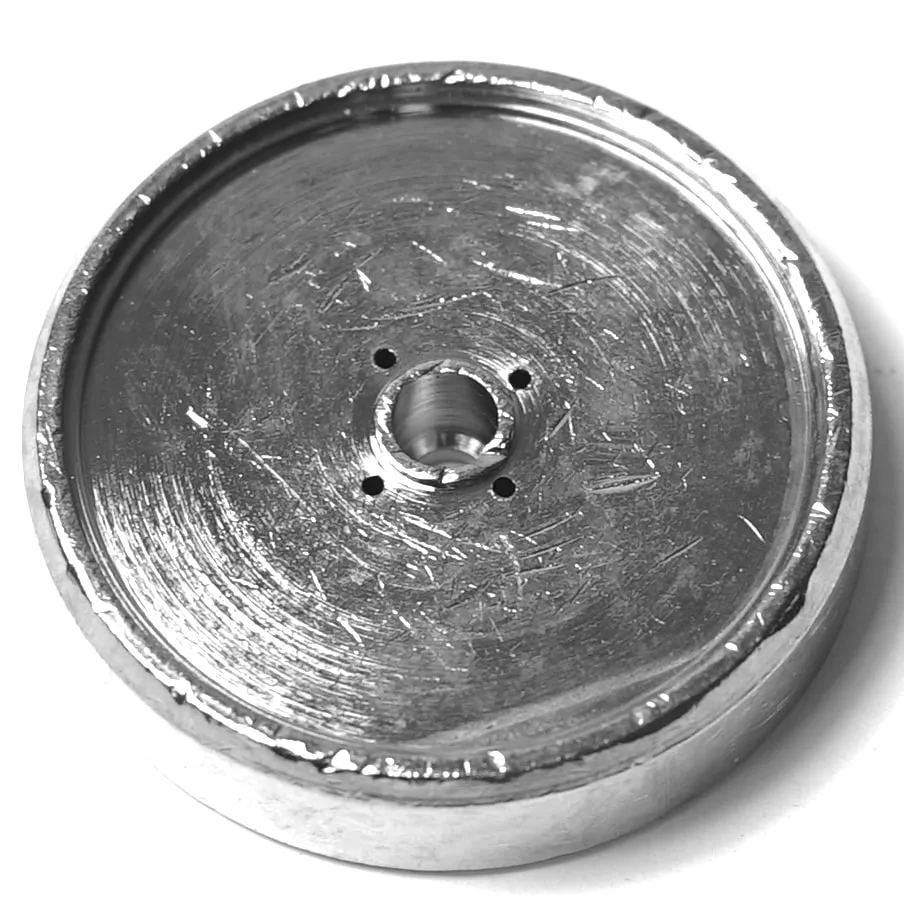 A close-up of the SM..54 LEVER GROUP PISTON ROD WASHER, featuring a round metal body with a central threaded hole and three smaller holes, displaying its rugged, scratched surface texture. © 2025 1st-line.com
