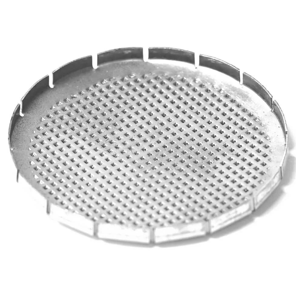 A round metal plate with a grid of raised spikes and evenly spaced vertical edge tabs, designed for group showers like the R..209 AT/S GROUP SHOWER. © 2025 1st-line.com
