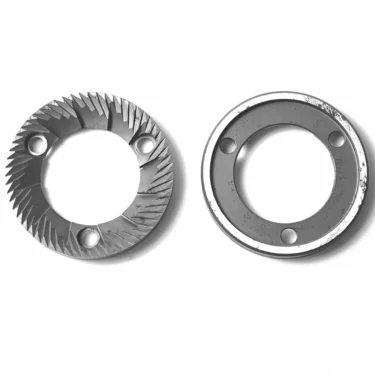 MC..43 RANCILIO GRINDING BURRS (75x43x10.5mm): Two metal burrs on a white background—one with sharp, angled teeth and three holes, the other flat and smooth with four holes. © 2025 1st-line.com