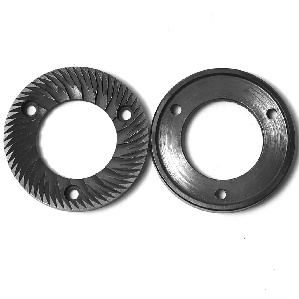 Two Ascaso MCP168 MACAP GRINDING BURRS are side by side on a white background; the left burr features sharp spiral grooves, and the right is smooth with three mounting holes, illustrating key aspects of this replacement part set. © 2025 1st-line.com