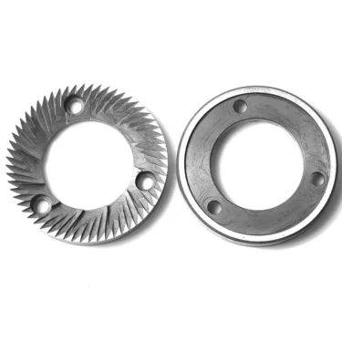 Two MC..43 RANCILIO GRINDING BURRS (75x43x10.5mm)—one with sharp angled ridges, the other smooth with four holes—used in coffee grinding, are shown on a white background. © 2025 1st-line.com