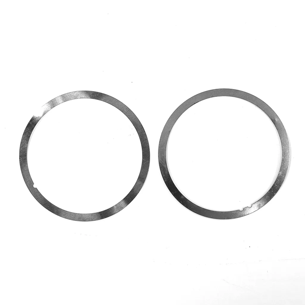 Two thin metallic circular rings from the Fiorenzato 900001434/R Burrs Thickness Kit, each with small notches, are placed side by side on a plain white background. © 2025 1st-line.com