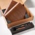Open cardboard box with the VBM WOODENKITDS Domobar Super Wood Kit: two wooden boards, foam insert with metal and wood-handled scoop, two round wooden pieces, and a small wooden stick. © 2025 1st-line.com