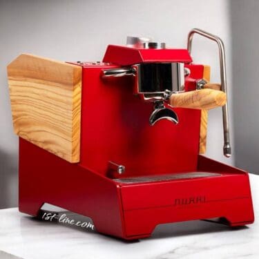 A modern red Nurri R-Type SB (HX) Espresso Machine with light wood accents and a wooden portafilter handle sits on a white countertop, featuring a metallic steam wand on the right side. © 2025 1st-line.com