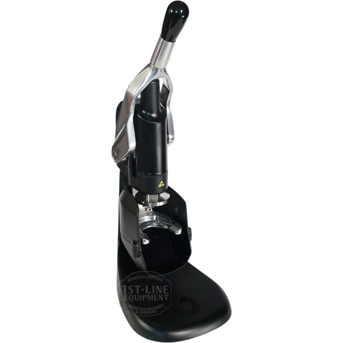 The Fiorenzato Rotodynamometric Tamper is a black manual coffee tamper with a lever handle, sturdy base, and metal-plastic build for evenly pressing grounds in a portafilter.