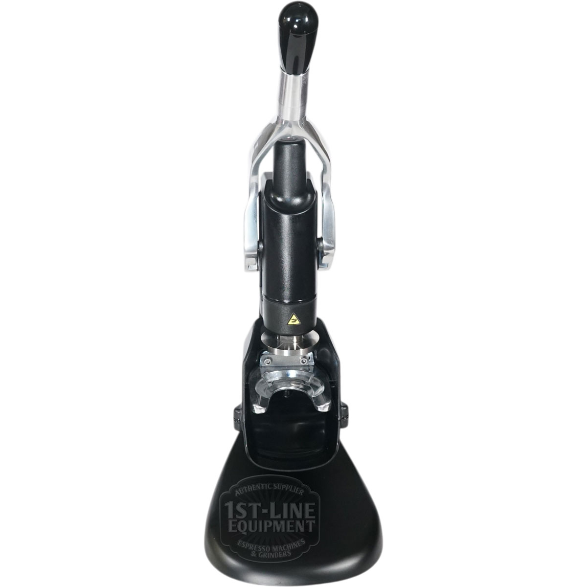 The Fiorenzato Rotodynamometric Tamper is visible below the lever handle of the manual espresso machine, which features a black base labeled 1st-Line Equipment and includes metal and black components, as seen from above.